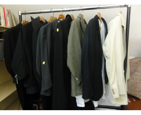 A quantity of gentleman's clothing including tail coat and waistcoat by Denman and Goddard of Eton, opera cloak with red lini