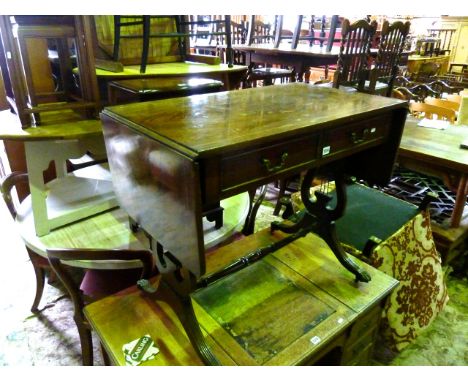 A reproduction Georgian style sofa table with two real and two dummy drawers, raised on lyre shaped supports with central rai