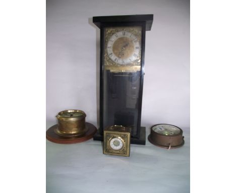 A brass bulkhead clock with eight day movement, a Ferranti bulkhead clock with electric movement, a wall clock with square br