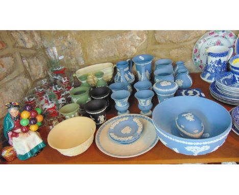 A quantity of Wedgwood blue ground Jasperwares including a fruit bowl, jug, egg shaped trinket box and cover, various vases e