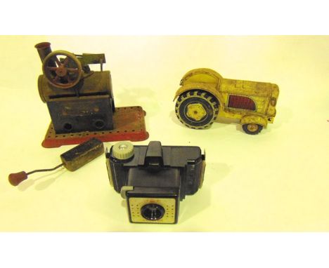 A small Mamod stationary engine, together with a Japanese tin plate tractor, a cased Coronet camera, a Willis "Star" cigarett