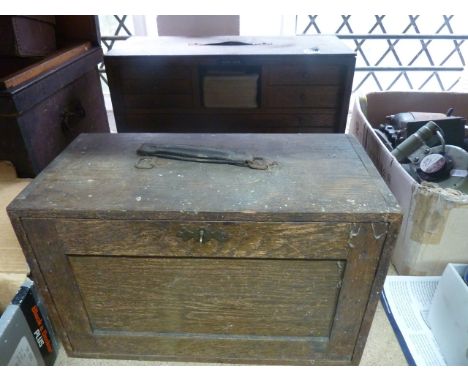 Two small vintage oak portable engineer's tool chests of varying size, each with a rectangular fall front enclosing shallow f