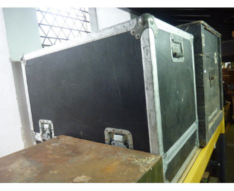 A lightweight travelling trunk with banded borders and flush fitting handles