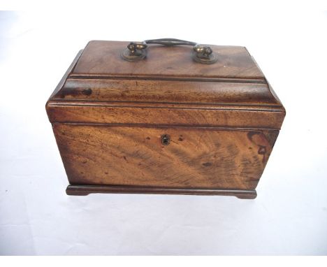 A Georgian mahogany veneered sarcophagus shaped tea caddy with brass looping handles, vacant interior to hinged lid, together