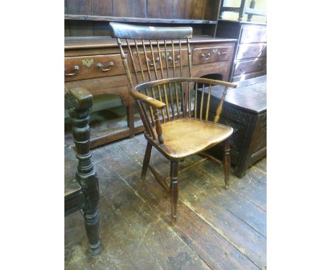 A 19th century Windsor comb back elbow chair, principally in ash