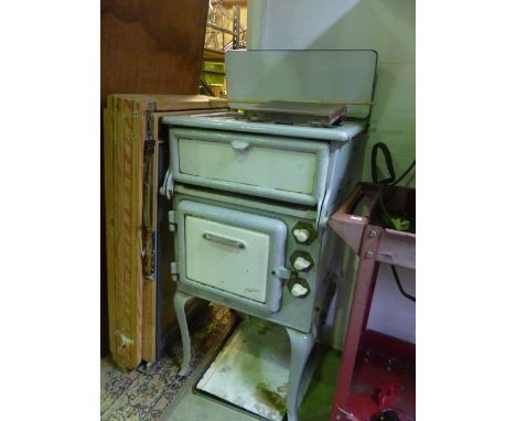 A vintage cast iron and enamel cooker/stove (grey and cream) by Jackson, with three dials, raised on cabriole supports