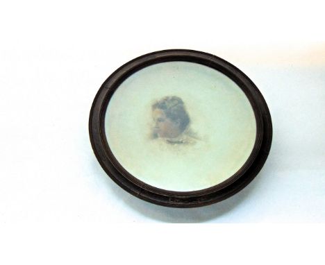 A Victorian opaque concave glass panel of circular form detailing a hand painted study of a female bust in side profile signe