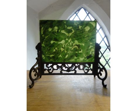 A carved jadeite panel with dragon, flaming pearl and cloud detail on a carved hardwood stand