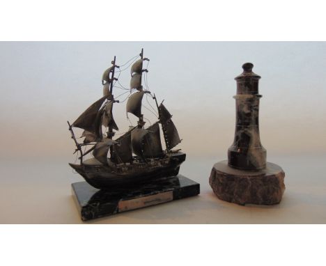 A miniature model of HMS Beagle under full sail, number 506/1,000 on marble base, a tortoiseshell box with tapestry top and a