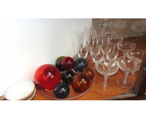 A selection of glassware to include six champagne flutes with hollow twisted stems, together with six similar champagne glass