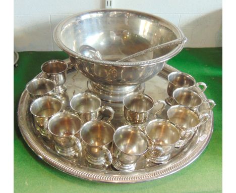 A substantial silver plated tray of circular form with fluted border and embossed central decoration, 53cm in diameter approx