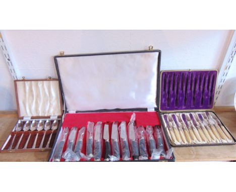 A cased set of six knives and forks with stainless steel blades by K Bright Limited of Sheffield, all with antler handles, to