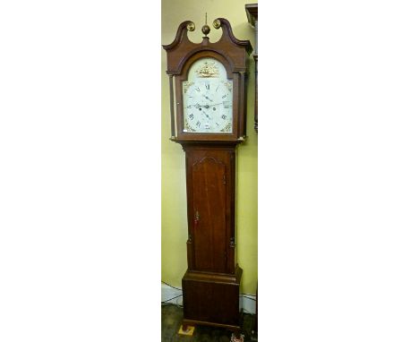 A Georgian oak longcase of neat proportions, the trunk with reeded and canted corners, the hood with reeded columns and swan 