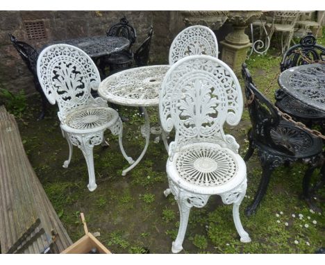 A Victorian style painted cast aluminium garden terrace table of circular form with decorative pierced scrolling acanthus top