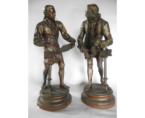 A substantial pair of spelter figures (weighted), one depicting a male musician playing a violin in 18th century dress, the o