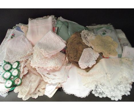 A mixed quantity of textiles to include embroidered and other white tablecloths and domestic ware, lace and other doilies, et