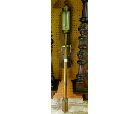 A Georgian style ship's stick barometer in brass with silvered dial and gimbel mounts