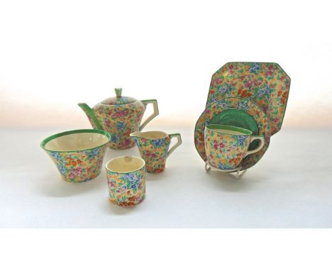 A collection of Barker Brothers Tudor Ware chintz teawares comprising a teapot, milk jug, sugar bowl, cylindrical pot and tea