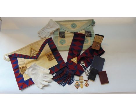 A collection of masonic regalia, including apron, gloves, sash, books etc, together with a silver teaspoon, a small silver ha