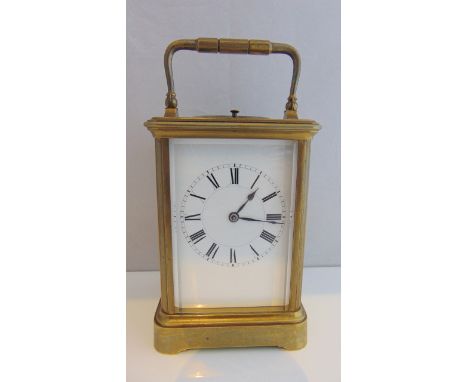 A brass carriage clock by Henri Jacot with eight day striking and repeat mechanism, case and movement number 16909