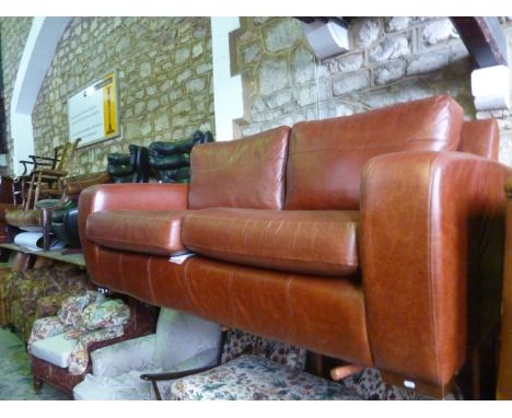 An Art Deco style tan coloured (Saddle Hazel) leather sofa from The Leather Workshops, 190cm in length