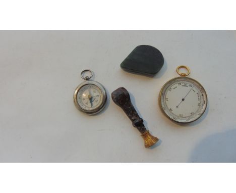 An early 19th century wax seal with chased framework and agate handle, pocket barometer, and brass cased pocket compass