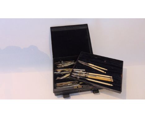 A collection of draughtsman tools, some with bone handles, marked Cary, others in brass and steel, 18 items in a tin case