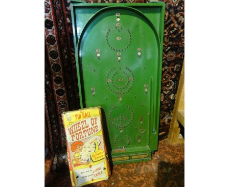 A green painted 20th century bagatelle games board together with boxed game "The Pin Ball Wheel of Fortune"