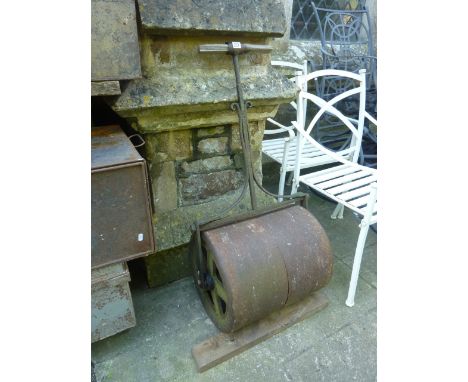 A 19th century cast iron garden roller with wrought iron frame and T-shaped handle