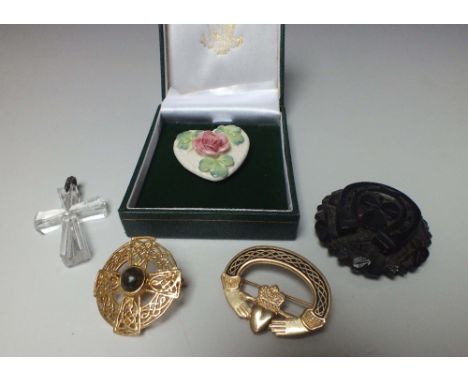 A WATERFORD CRYSTAL CRUCIFIX PENDANT, together with a carved bog oak roundel with shamrock decoration, a box Belleek ceramic 