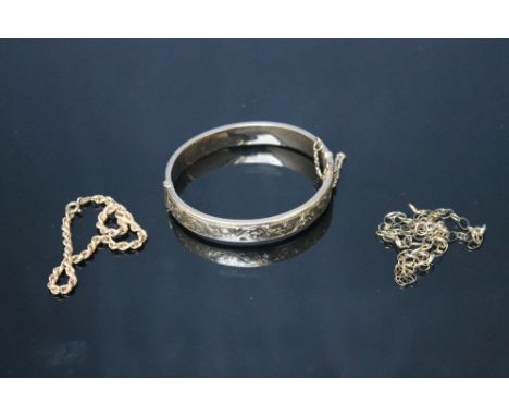 A HALLMARKED 9 CARAT GOLD BANGLE, a/f, together with two gold chains, approx combined weight 16.88 g