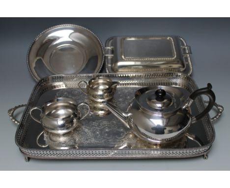 A SELECTION OF SILVER PLATED WARE CONSISTING OF A THREE PIECE TEA SERVICE - MAKERS MARK H &amp; H, a twin handled pierced gal