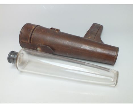 A LEATHER CASED GLASS SPIRIT BOTTLE / FLASK, with white metal mounts, L 22.5 cm