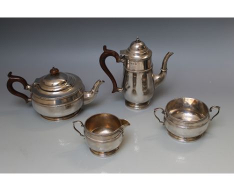 A HALLMARKED SILVER FOUR PIECE BACHELORS TEA AND COFFEE SERVICE - BY THE ALEX CLARKE COMPANY LTD. LONDON 1938, consisting of 