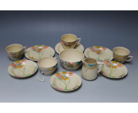 A SELECTION CLARICE CLIFF TEAWARE PAINTED WITH A FLORAL PATTERN, comprising of three matched trios, one large sugar bowl, one