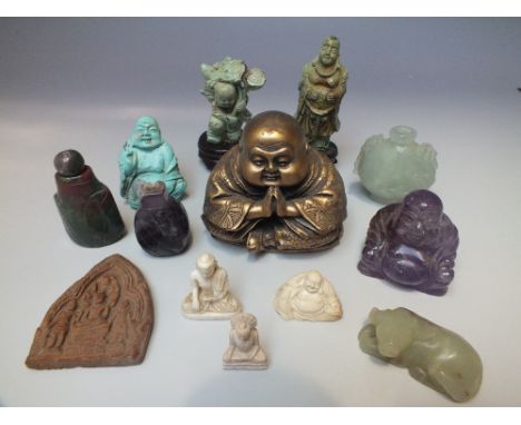 AN ORIENTAL CARVED AMETHYST FIGURE OF A BUDDHA, together with a small carved bone Buddha figure, a further collection of mode