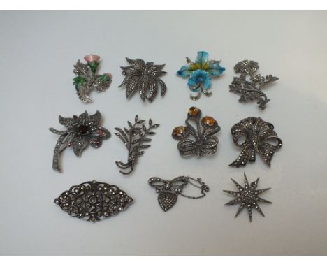 A COLLECTION OF MOSTLY SILVER MARCASITE SET BROOCHES, to include gemset and enamel examples, and a vintage 'Birks' brooch (11