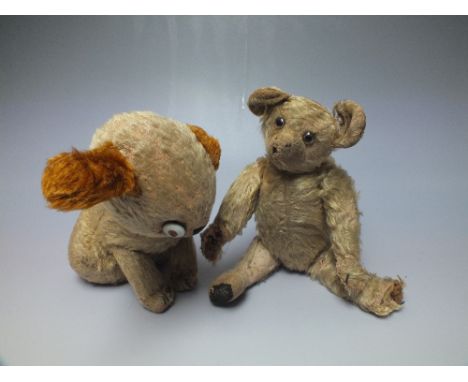 A WELL LOVED EARLY 20TH CENTURY SMALL MOHAIR TEDDY BEAR, fully jointed, straw filled, glass eyes, approx H 30 cm, together wi