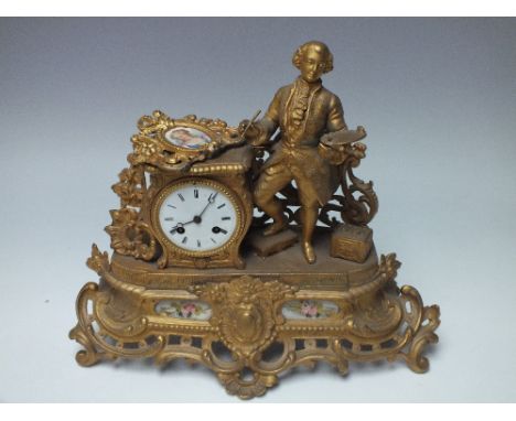 A GILT METAL AND PORCELAIN MANTEL CLOCK A/F, the drum shaped movement striking on a bell, with painted ceramic portrait panel