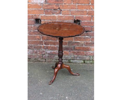 A MAHOGANY PEDESTAL TABLE, the shaped circular top with pie crust edging, raised on a snaplock mechanism and slender vase tur