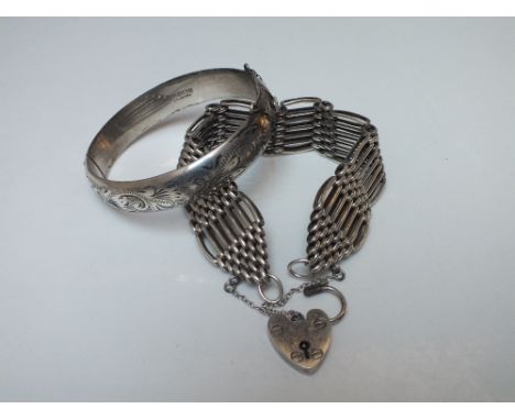 A HALLMARKED SILVER SEVEN BAR GATE BRACELET, with heart shaped clasp and safety chain, together with a hallmarked silver hing