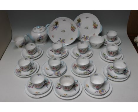 A SHELLEY 'WILD FLOWERS' THIRTY FIVE PIECE TEA SERVICE, consisting of a teapot, cream jug, sugar bowl, two cake plates, and t