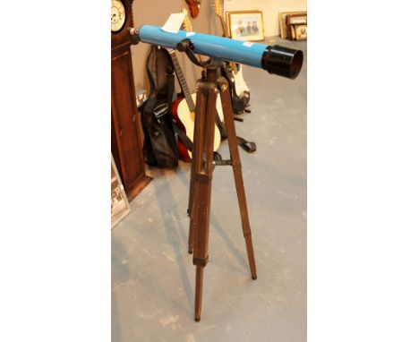 Vintage telescope with adjustable wooden tripod