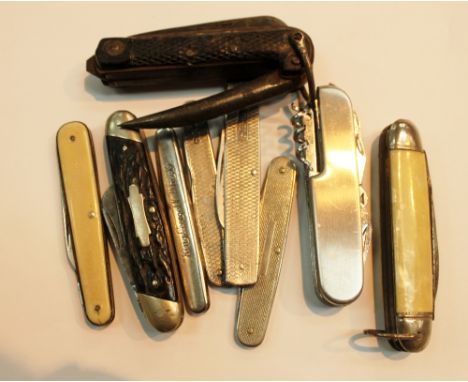 Eight vintage pen knives including a hallmarked silver example