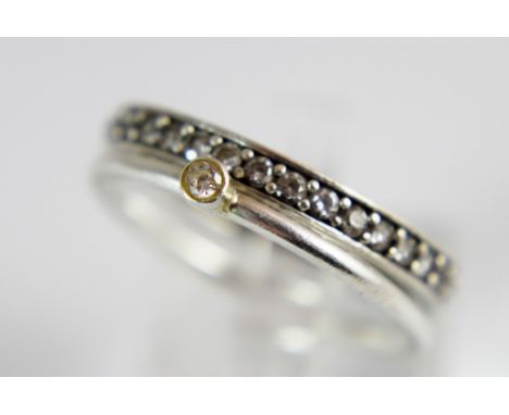 Sterling silver full eternity ring and a sterling silver narrow band solitaire ring, sizes P and R