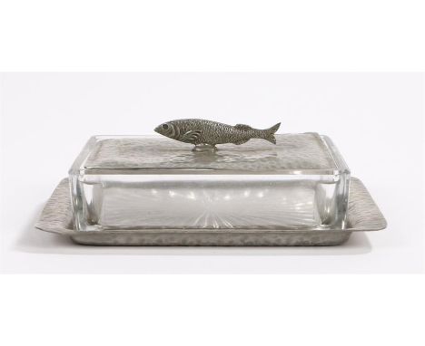 Pewter and glass sardine dish, the beaten pewter cover with fish form finial above a clear glass lower section and beaten pew