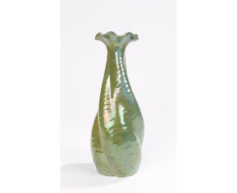 Art Nouveau ceramic vase in style of Christopher Dresser, with flared rim, twisted ridged body covered in an olive green lust
