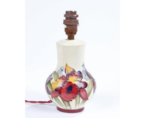 Moorcroft pottery lamp, the cream ground with iris decoration, impressed marks to base, 25cm high