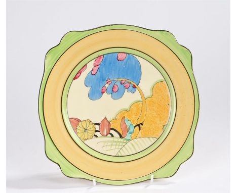 Clarice Cliff plate, decorated with a stylised tree and flowers, with orange, green and black banded exterior, 25cm diameter