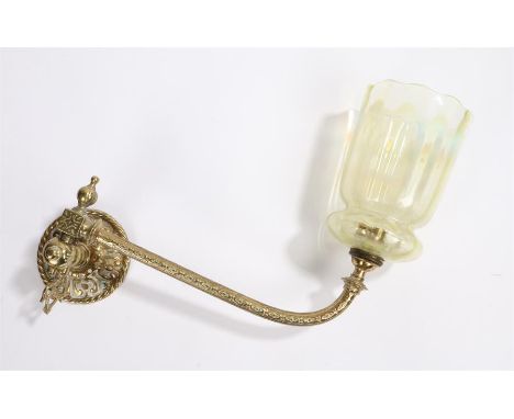 Vaseline glass wall light, with a gilt metal fitting and long curved arm to the Vaseline glass shade